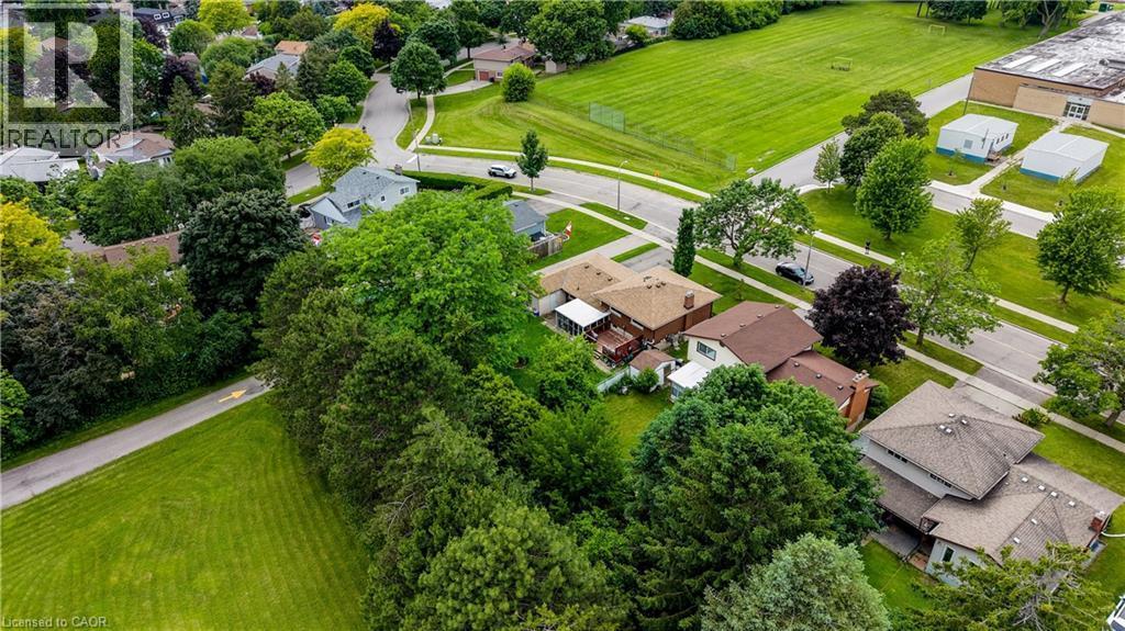 Residential neighborhood featuring varied architectural styles and mature tree coverage - 619 Forest Hill Drive, Kitchener, ON