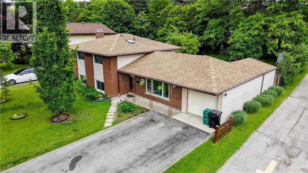 Two-story brick and siding residence with an attached garage - 619 Forest Hill Drive, Kitchener, ON