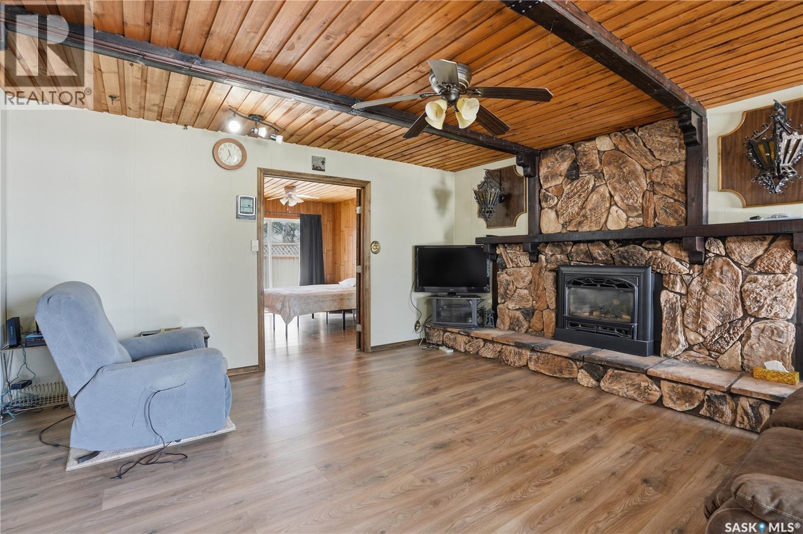 205 Bay Drive W, Christopher Lake, SK - Indoor Photo Showing Living Room With Fireplace