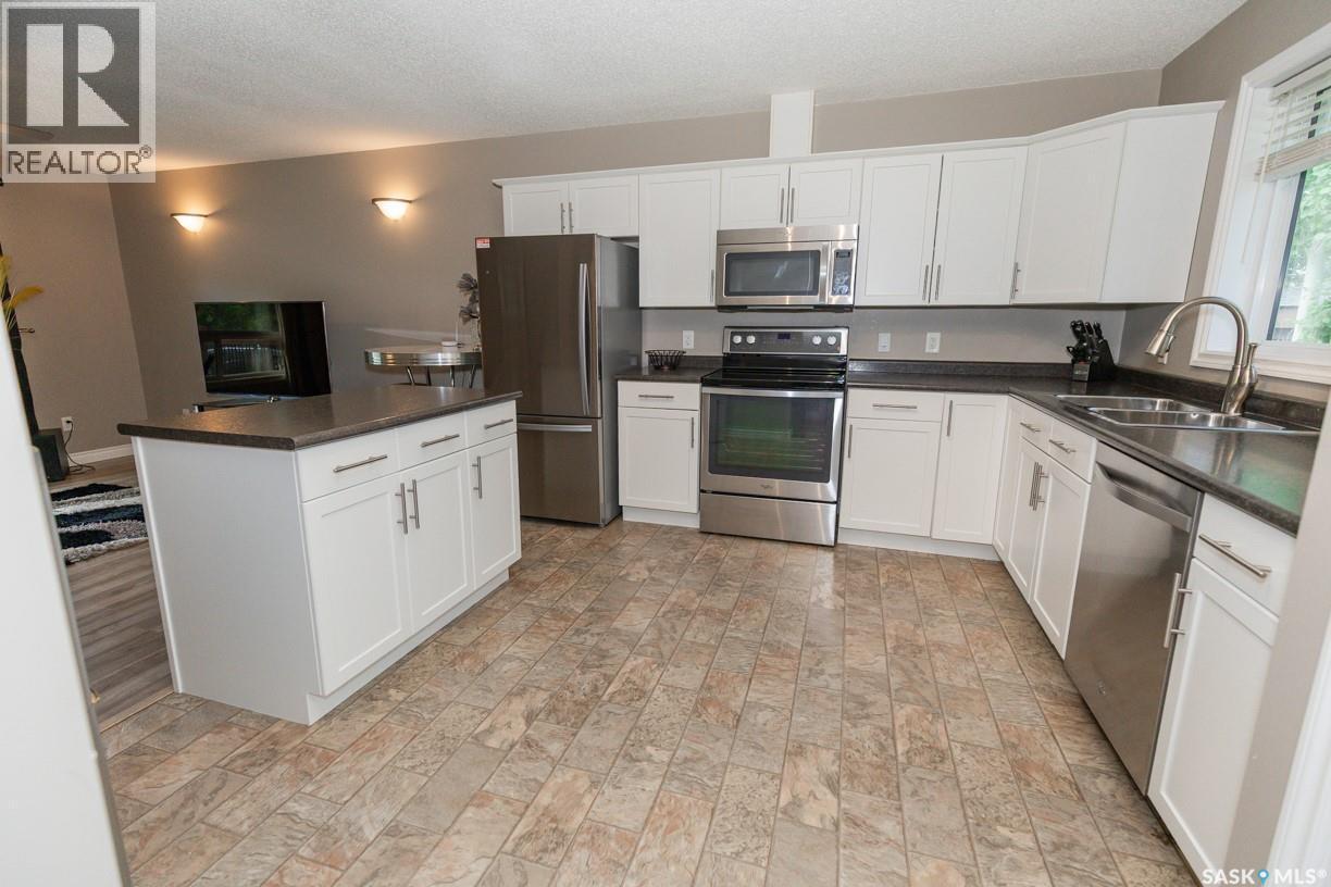 111 4Th Avenue, Coleville, SK - Indoor Photo Showing Kitchen With Double Sink