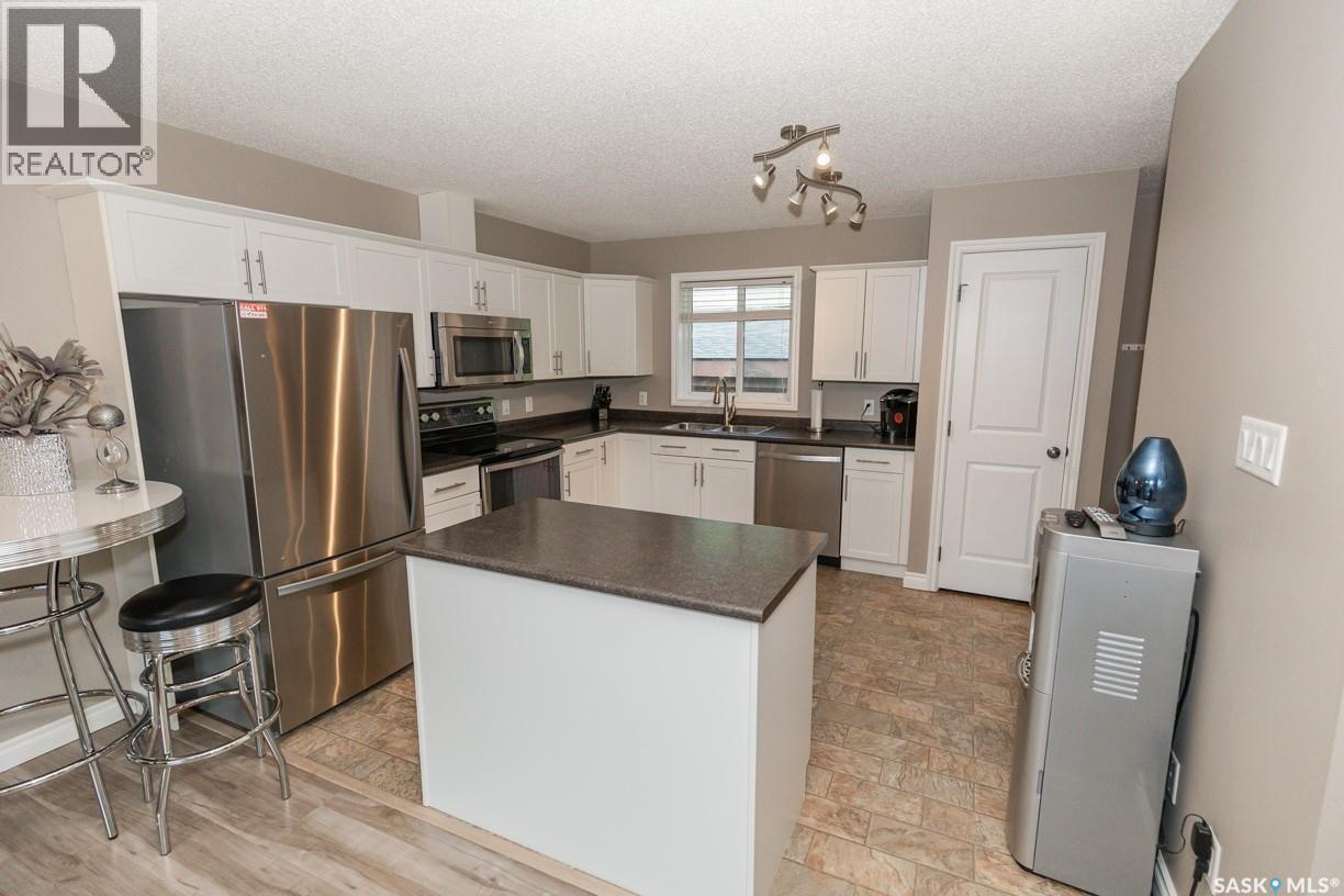 111 4Th Avenue, Coleville, SK - Indoor Photo Showing Kitchen With Double Sink