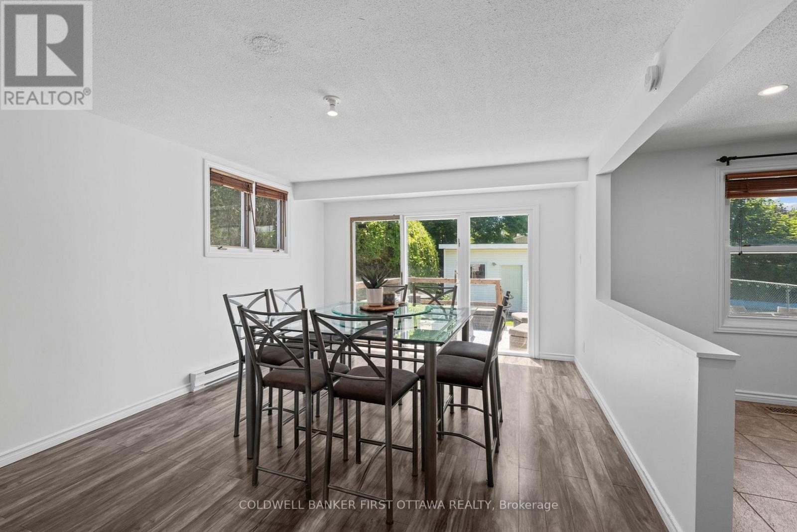 Dining room w walkout to the back deck + Pool! - 12 Bradgate Drive, Ottawa, ON