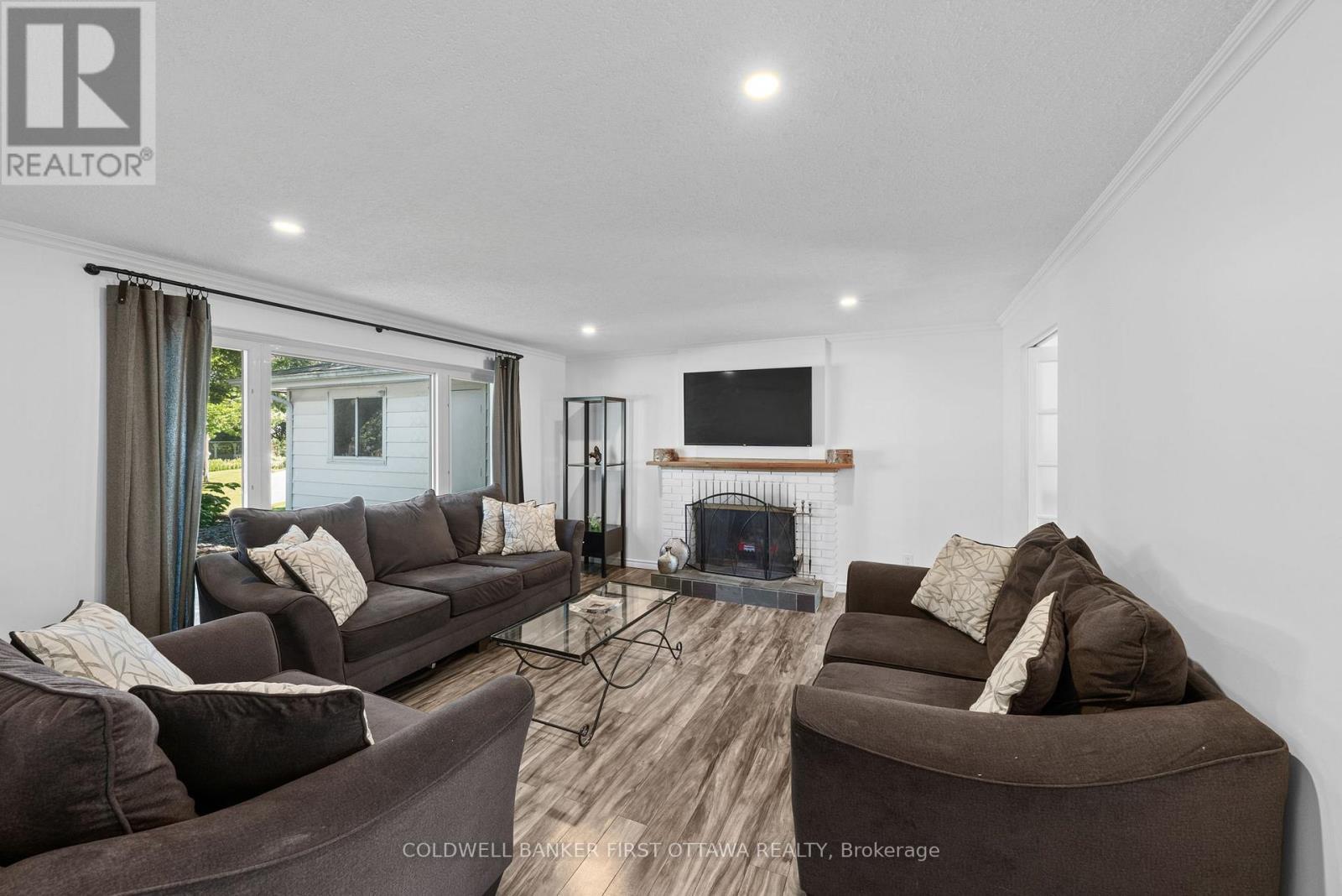 Bright & open living room w wood fireplace! - 12 Bradgate Drive, Ottawa, ON