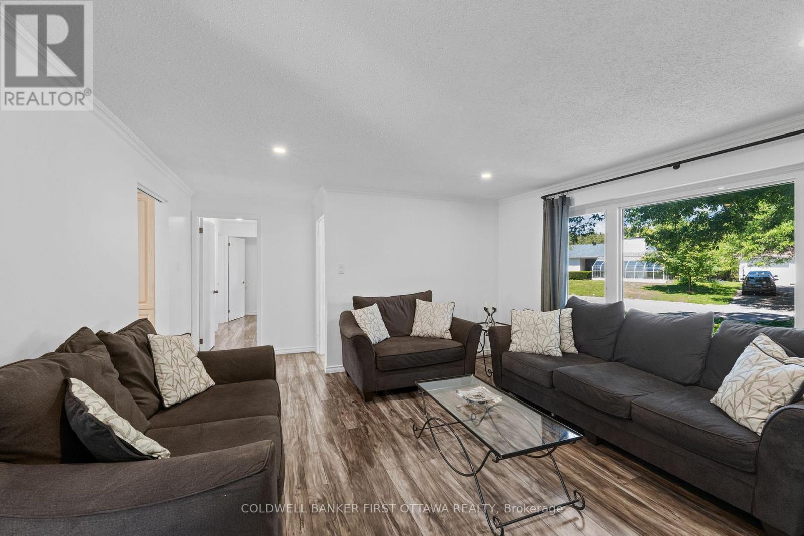 Wall to wall windows and access to kitchen/dining. - 12 Bradgate Drive, Ottawa, ON