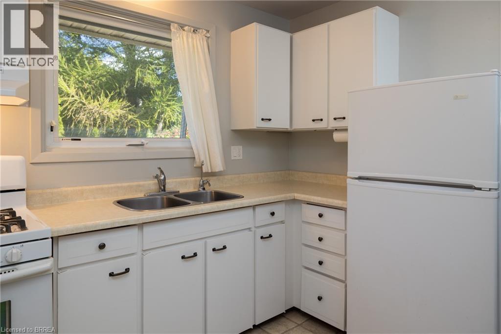 Room with light gray walls and square tile flooring - 156 Mutual Street N, Ingersoll, ON