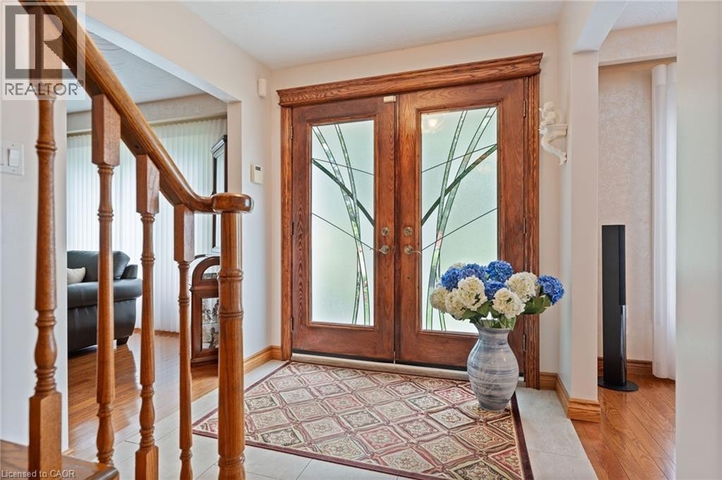 Wood double entry doors with decorative frosted glass panels - 7 Thomson Road, Simcoe, ON