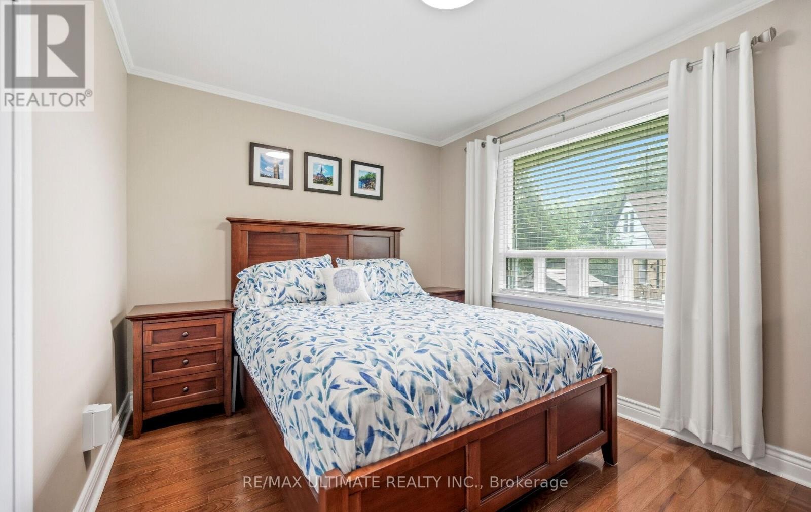 Bedroom 1 with large window overlooking backyard - 5 Mendip Crescent, Toronto, ON