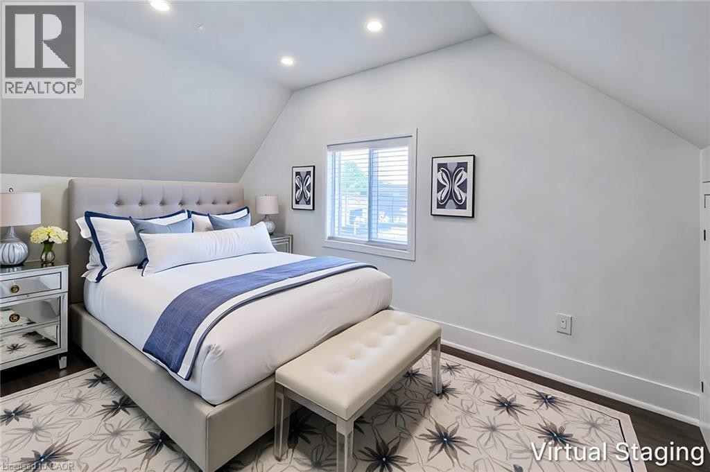 Bright room featuring sloped ceilings, recessed lighting, and dark wood-finish flooring - 78 Hillyard Street, Hamilton, ON