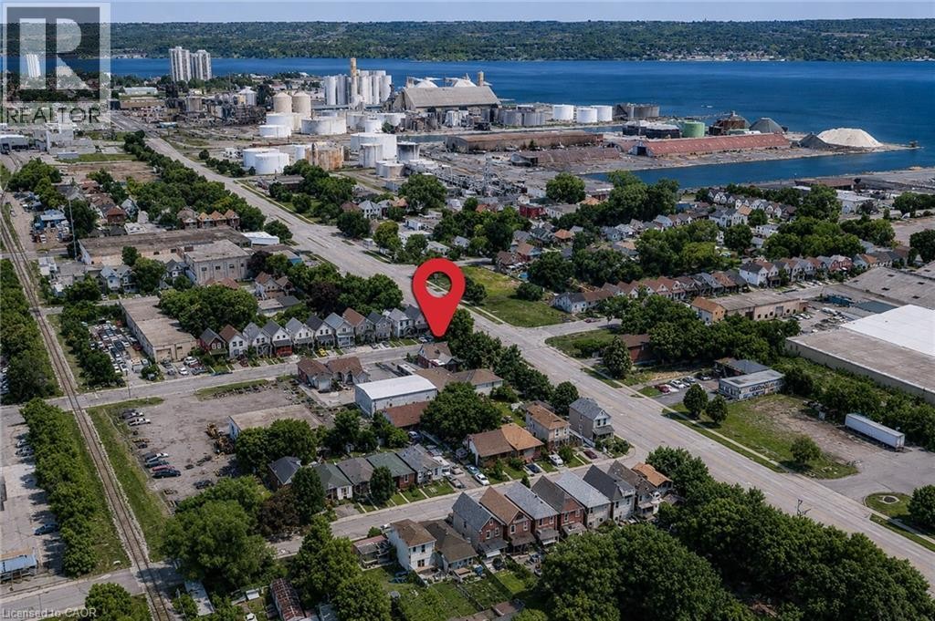 Aerial overview of a residential area featuring multiple single-family homes and structures - 78 Hillyard Street, Hamilton, ON