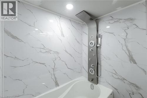 Integrated shower panel with multiple spray functions, handheld shower, and an overhead rainfall showerhead - 78 Hillyard Street, Hamilton, ON 