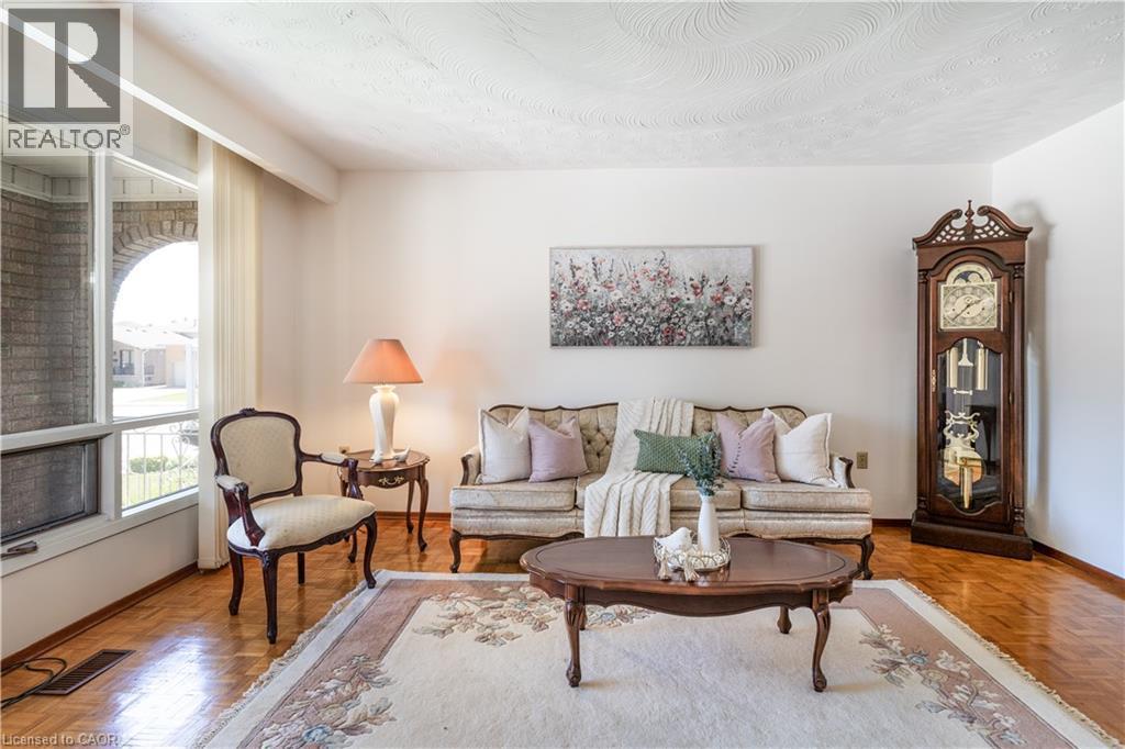A sun-filled formal living room - 102 Markson Crescent, Hamilton, ON