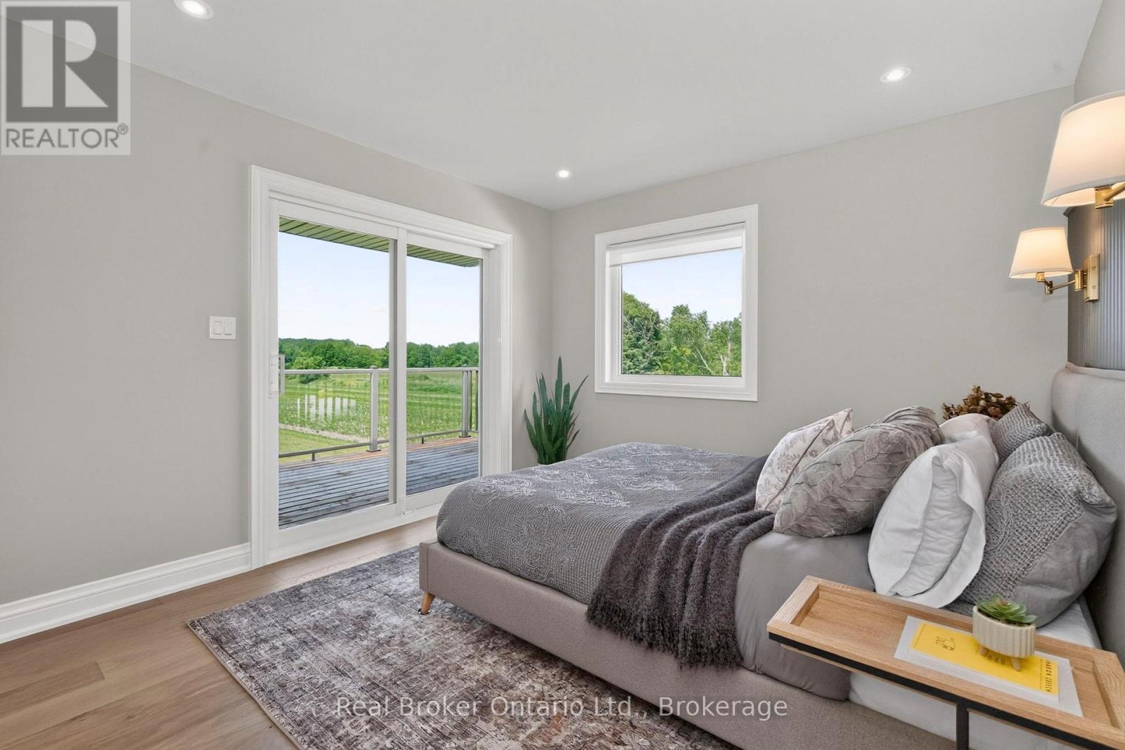 Primary w/Walkout to Private Deck & Westerly View - 930 Marshall Road, Tiny, ON