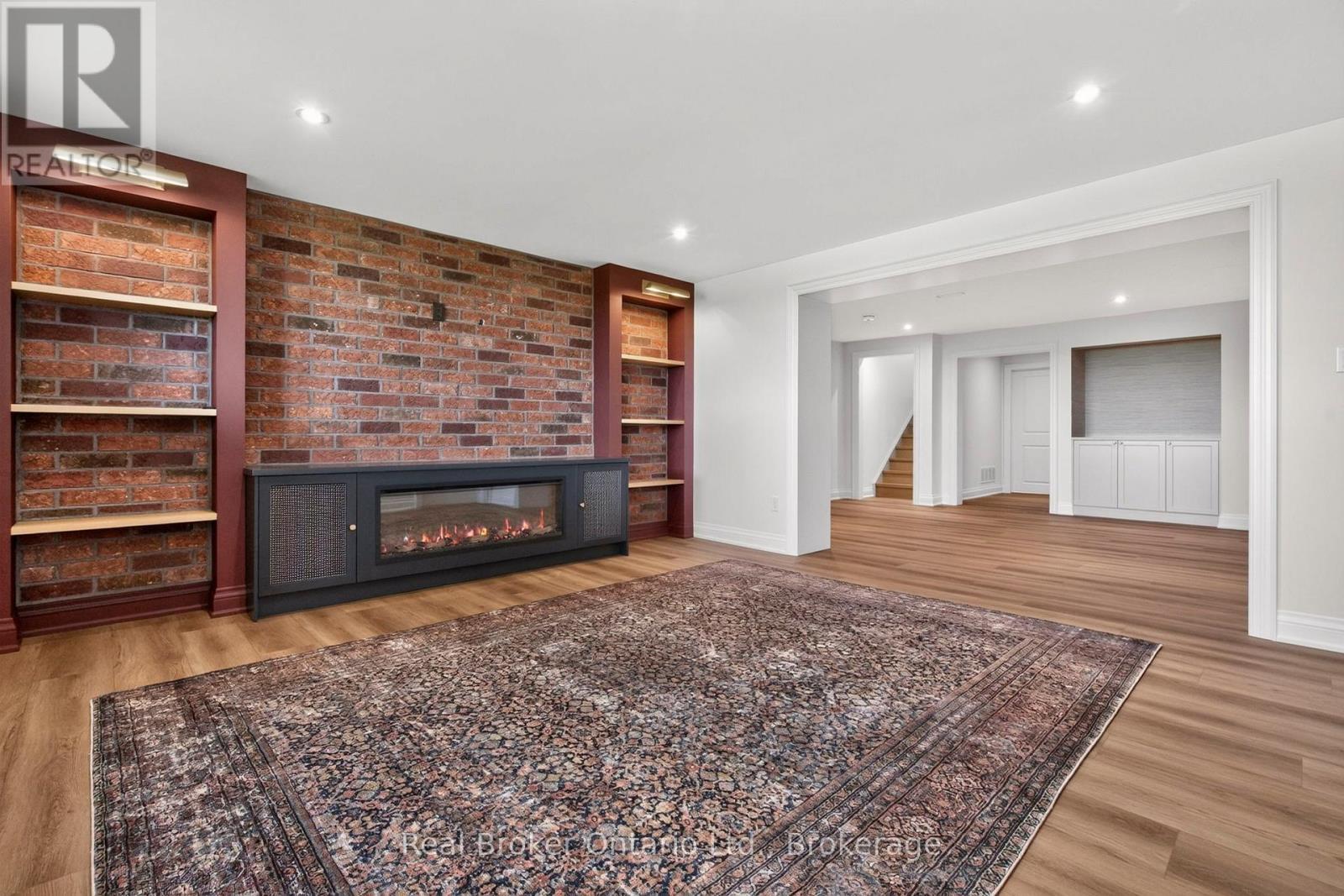 Brick Feature Wall w/Built-in Shelves - 930 Marshall Road, Tiny, ON