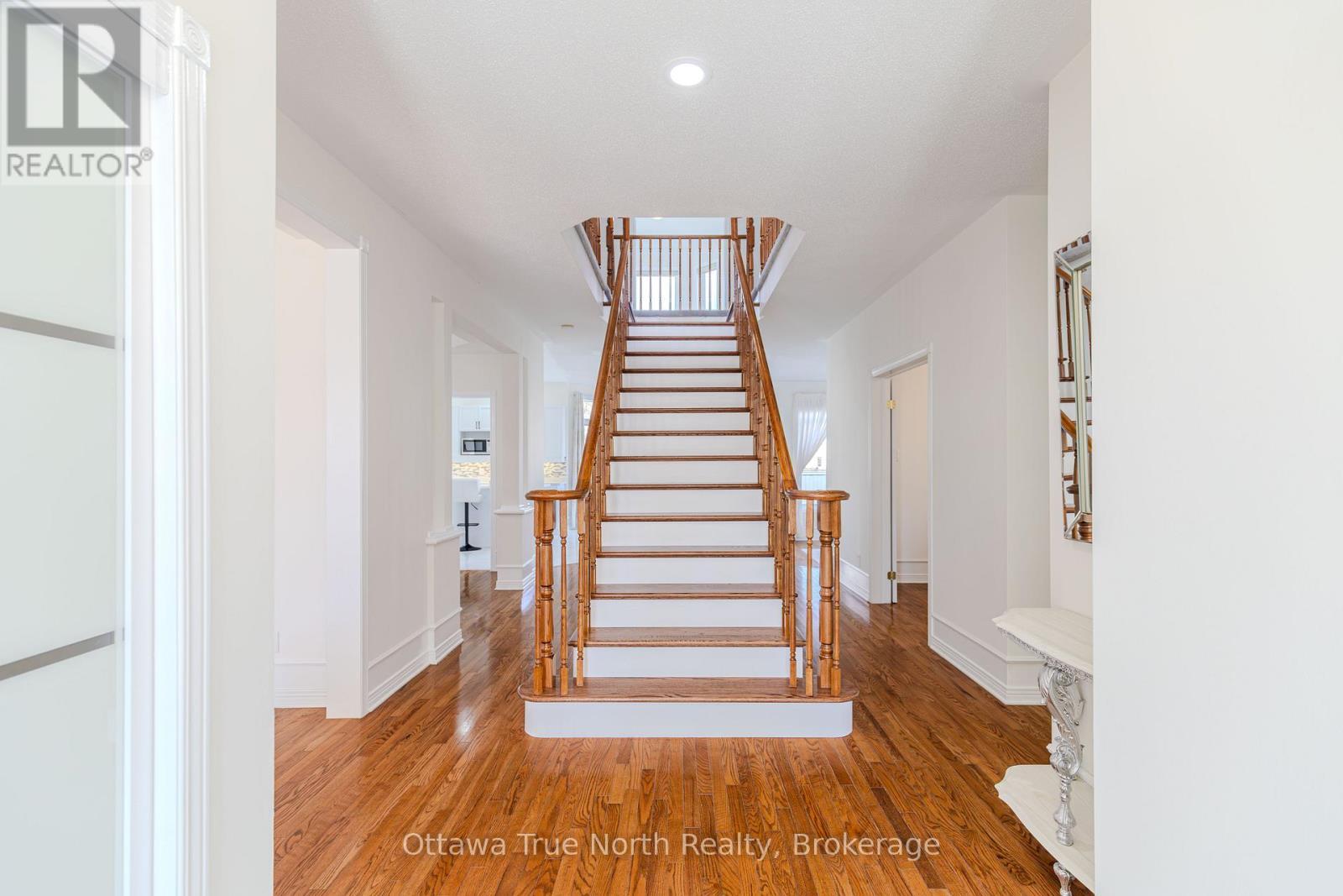 Elegant staircase as focal point welcome! - 19 Black Tern Crescent, Ottawa, ON