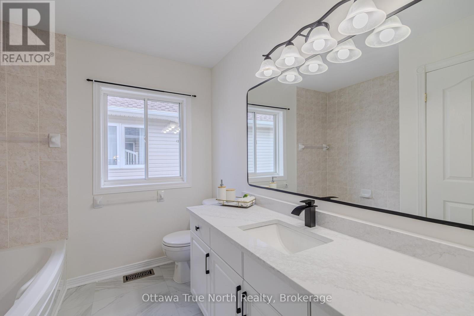 Renovated Main bath with LARGE window - 19 Black Tern Crescent, Ottawa, ON