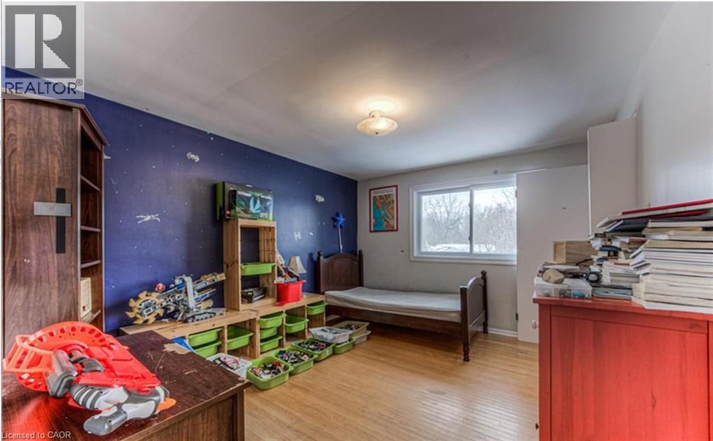 Hardwood flooring and a large window provide natural light - 110 Wren Place Unit# Upper, Kitchener, ON - Indoor Photo Showing Other Room