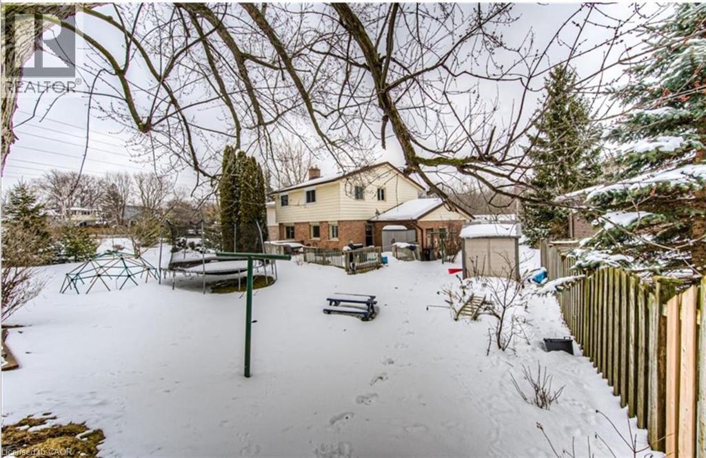 Spacious rear yard with established trees and privacy fencing - 110 Wren Place Unit# Upper, Kitchener, ON - Outdoor
