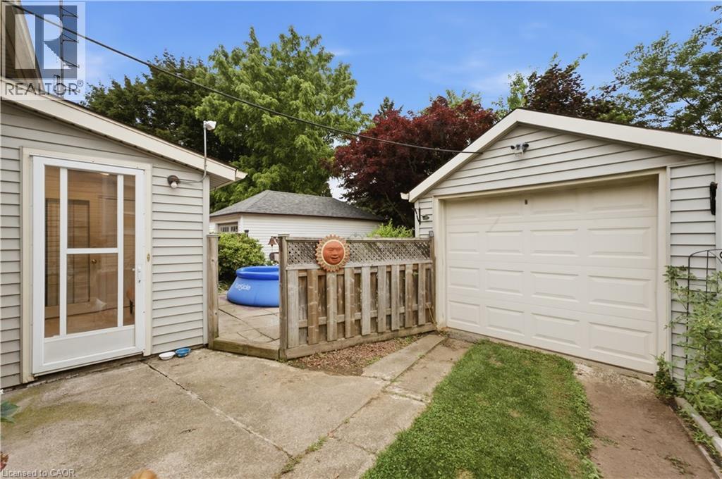 Detached garage with white panel door - 81 Vale Avenue, St. Catharines, ON