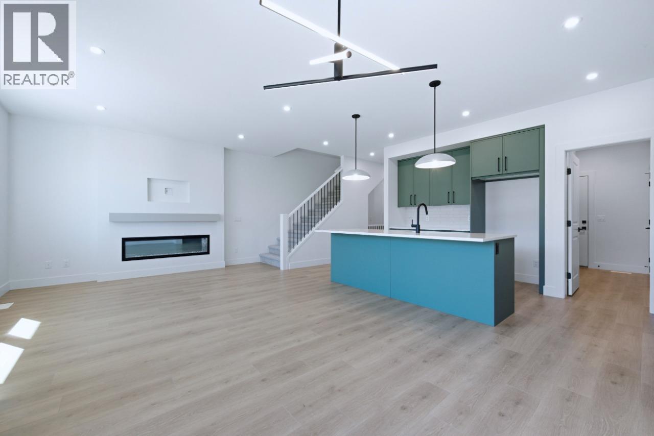 377 Arrowleaf Rise, Coldstream, BC - Indoor With Fireplace