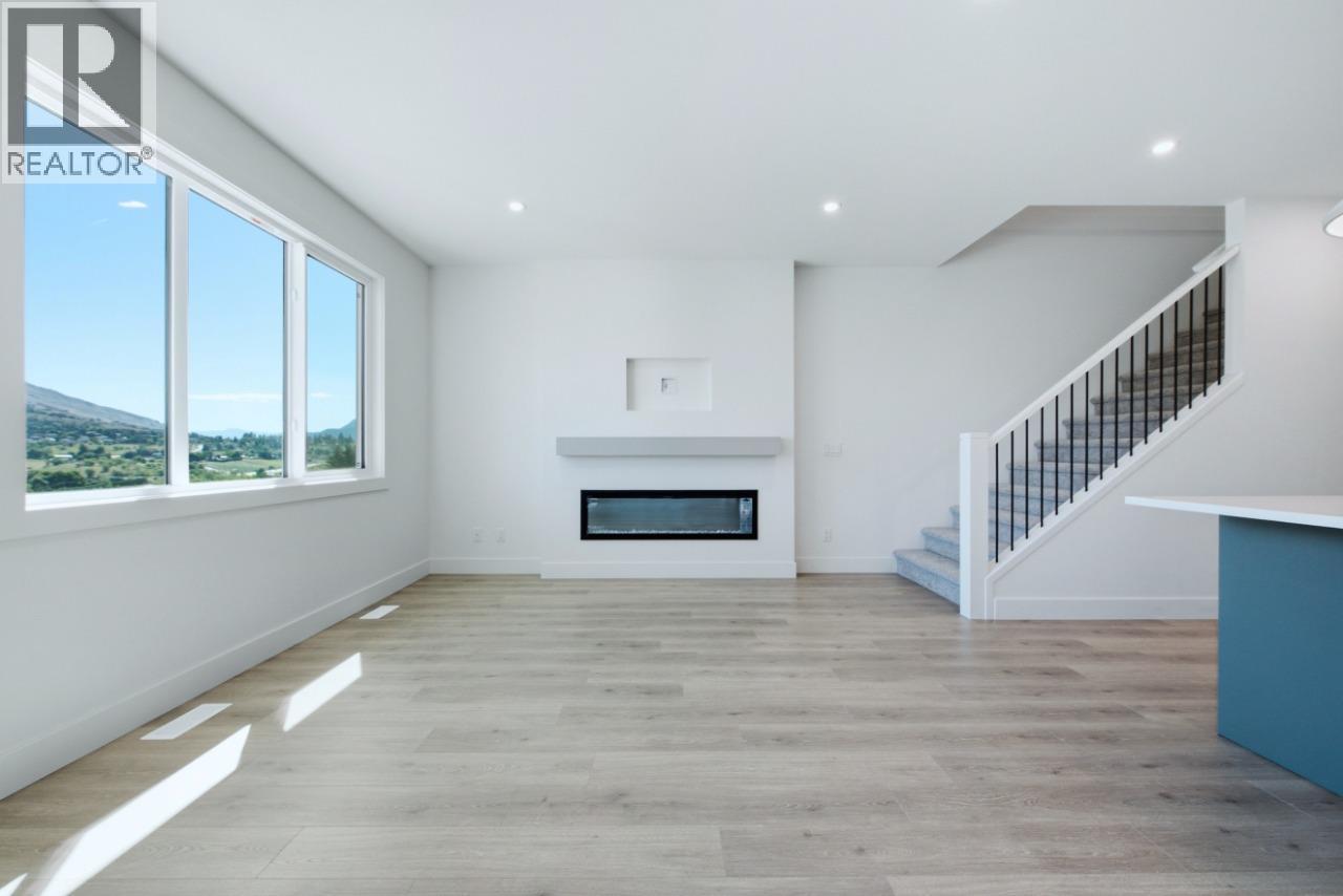 377 Arrowleaf Rise, Coldstream, BC - Indoor With Fireplace
