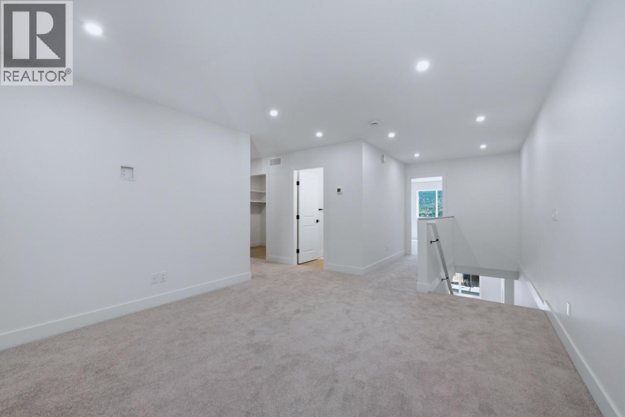 377 Arrowleaf Rise, Coldstream, BC - Indoor Photo Showing Other Room