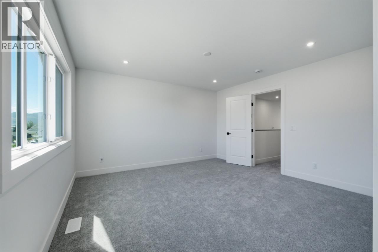 377 Arrowleaf Rise, Coldstream, BC - Indoor Photo Showing Other Room