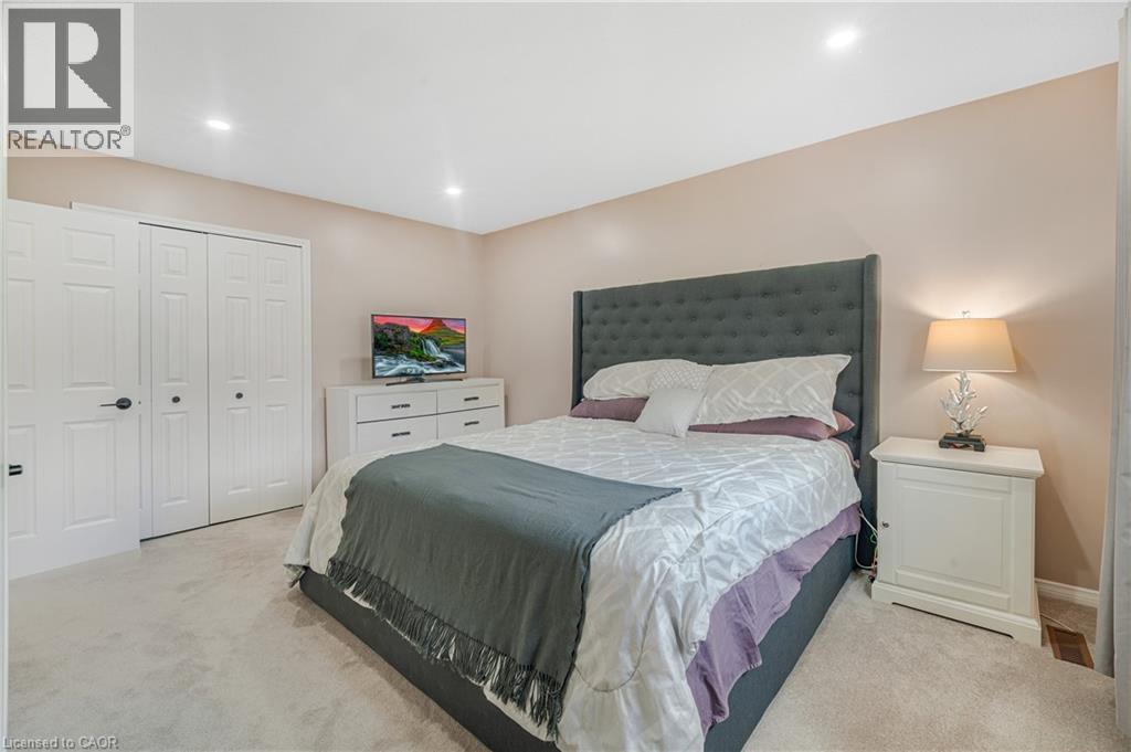 Plush carpeting, recessed ceiling lighting, and a neutral wall palette create a bright, inviting atmosphere - 23 Millpond Place, Mountain, ON