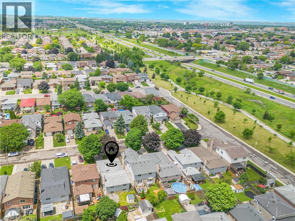 Aerial perspective showcasing a residential neighborhood with varied housing styles - 23 Millpond Place, Mountain, ON