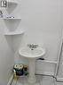 Pedestal sink with chrome fixtures and white tile flooring - 648 King Street E, Cambridge, ON 