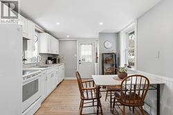 Kitchen with laundry area & access to the yard - 
