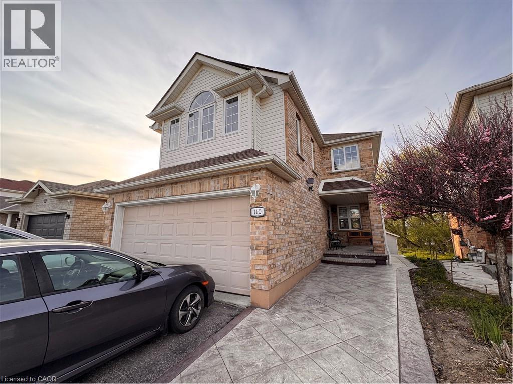 Brick and siding exterior with a two-car garage - 110 Marl Meadow Drive Unit# B, Kitchener, ON