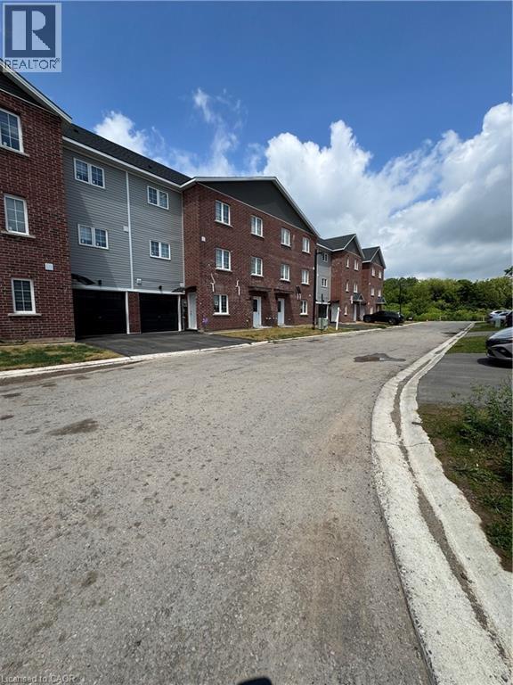Contemporary townhome-style residences featuring brick and siding exteriors - 119 Highriver Trail Unit# Main, Welland, ON - Outdoor