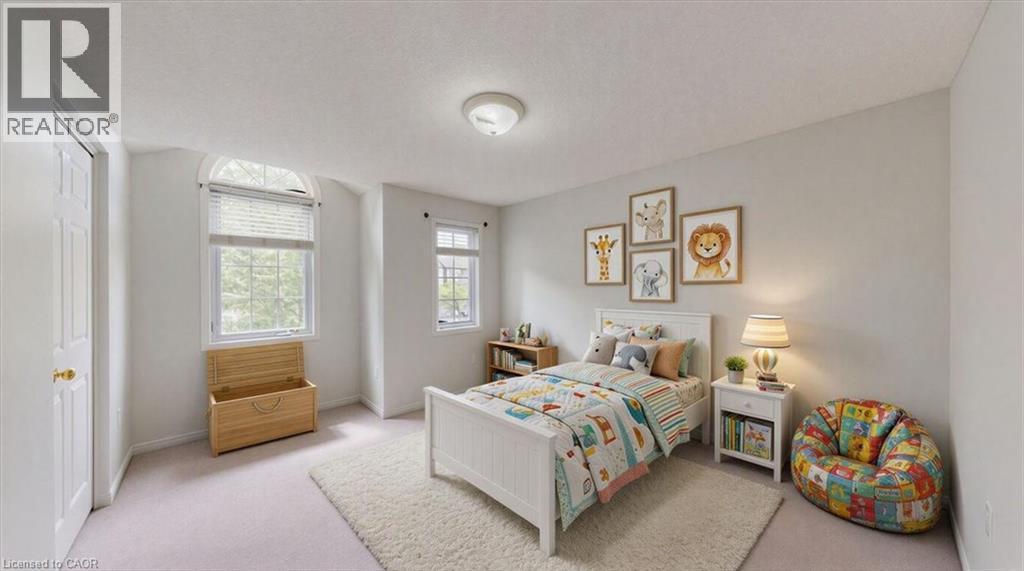 Bright bedroom with two windows, including an arched transom window, providing natural illumination - Virtually staged - 980 Creekside Drive, Waterloo, ON - Indoor Photo Showing Bedroom