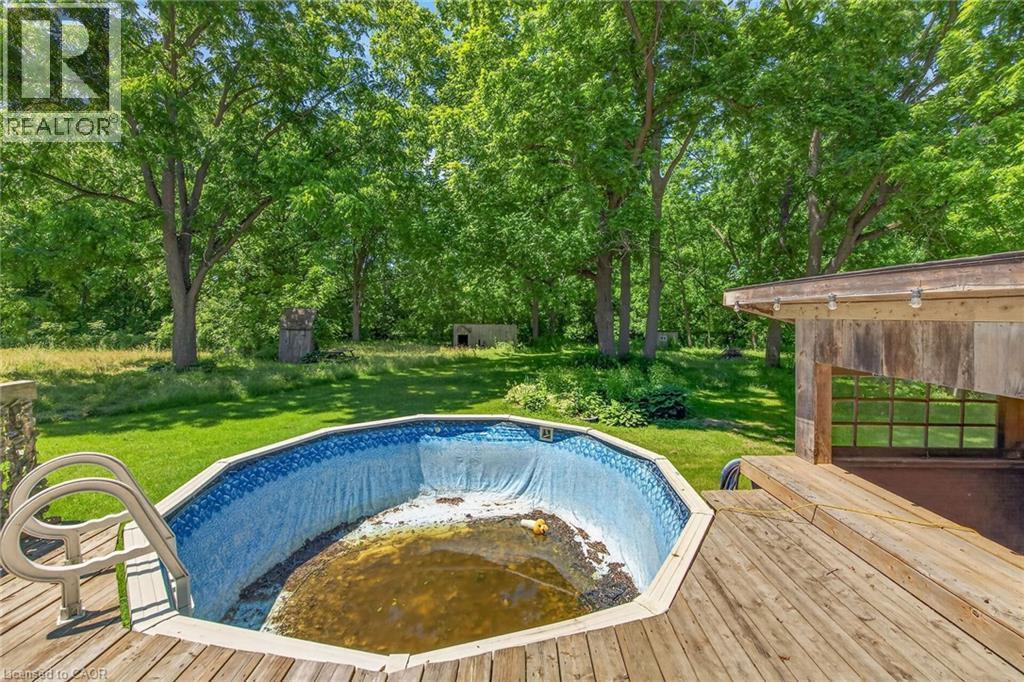 44 Sims Lock Road, Caledonia, ON - Outdoor With Above Ground Pool With Backyard