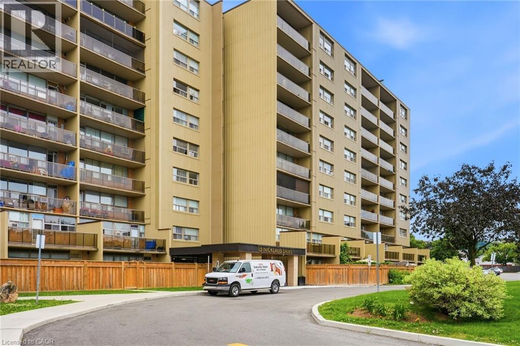 High-rise building exterior featuring multiple levels of private balconies with glass railings - 15 Nicklaus Drive Unit# 17, Hamilton, ON