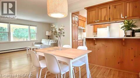 Open concept living and dining area featuring wood-finish flooring - 919 Montgomery Drive, Ancaster, ON
