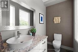 Powder Room off Foyer (Bathroom #1) -