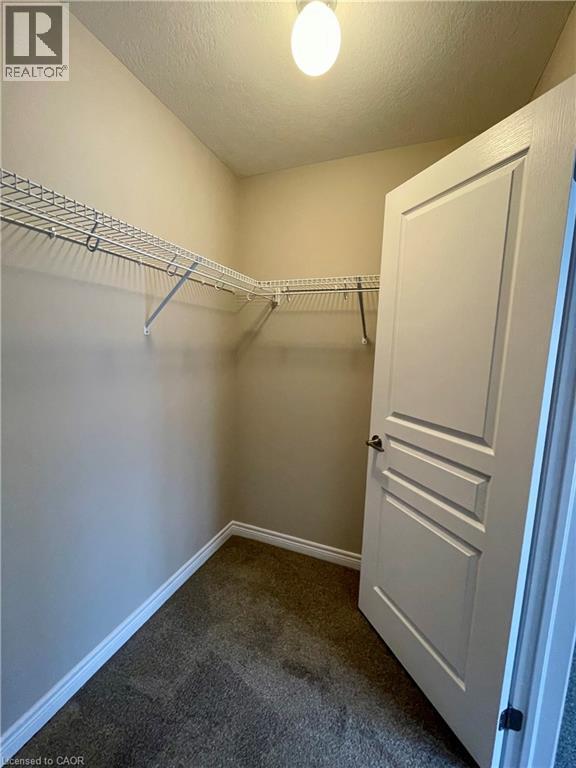 Walk-in closet - 76 Esplanade Lane, Grimsby, ON