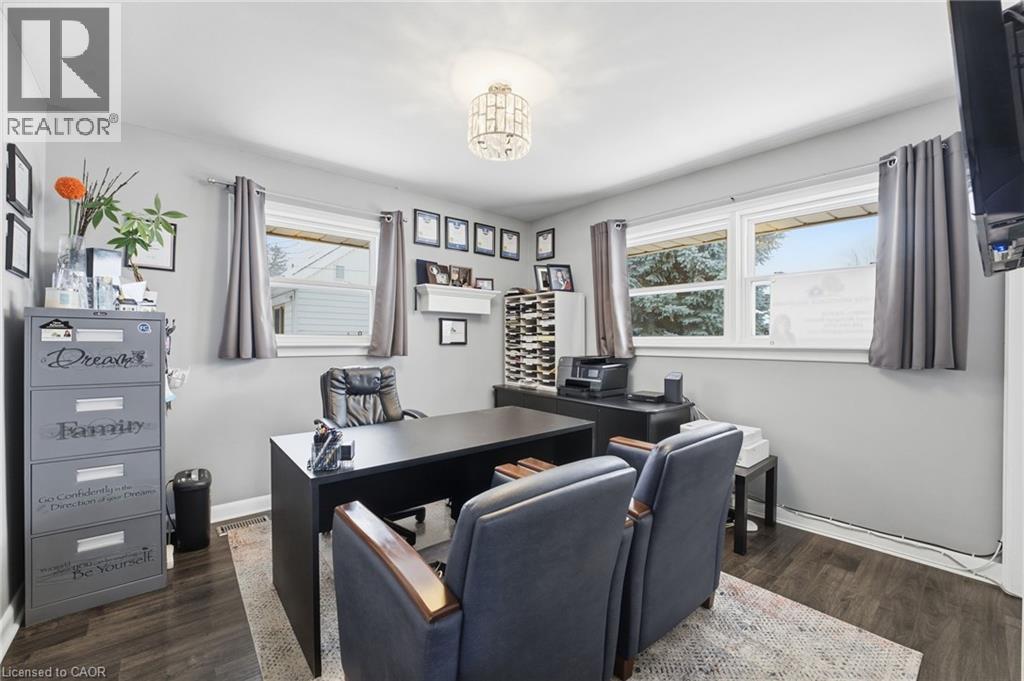 Office area with dark wood finished floors and baseboards - 473 Mohawk Road W, Hamilton, ON