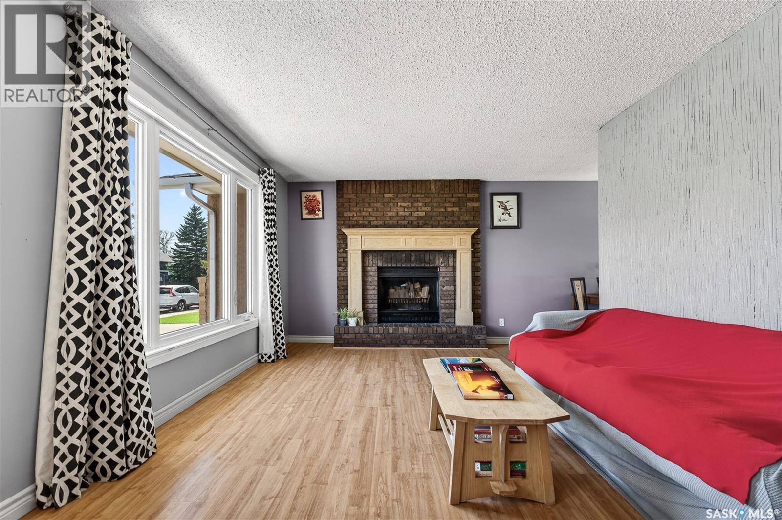 22 Edelweiss Crescent, Moose Jaw, SK - Indoor Photo Showing Living Room With Fireplace