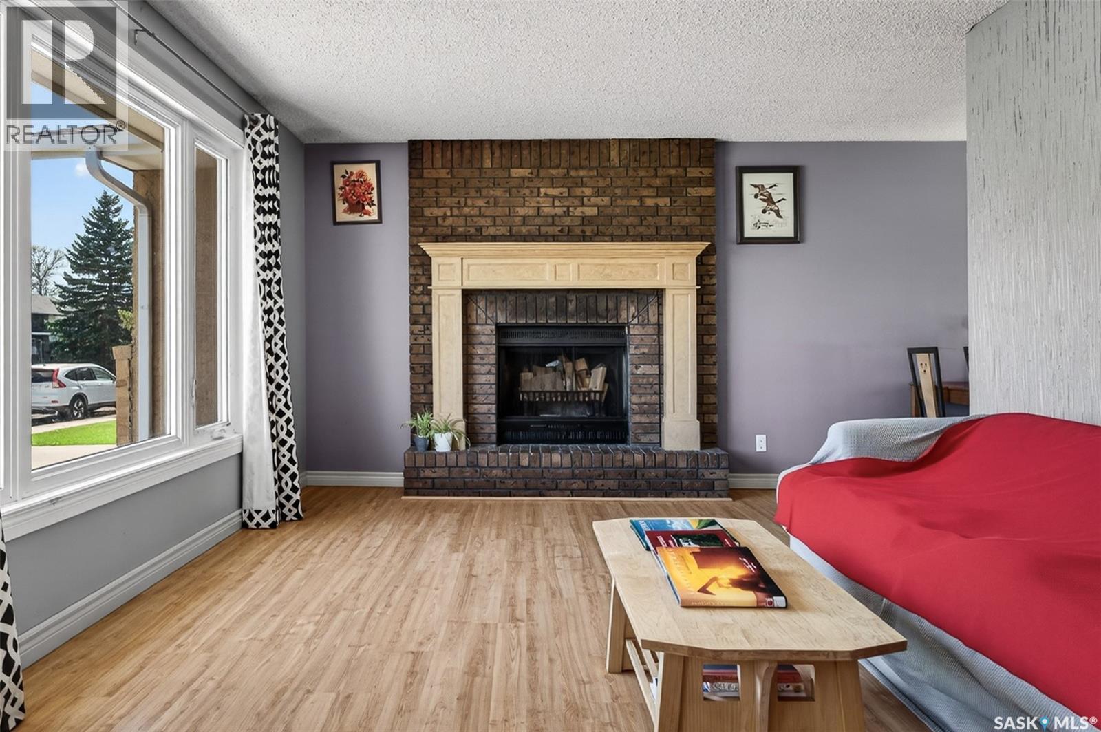 22 Edelweiss Crescent, Moose Jaw, SK - Indoor Photo Showing Living Room With Fireplace