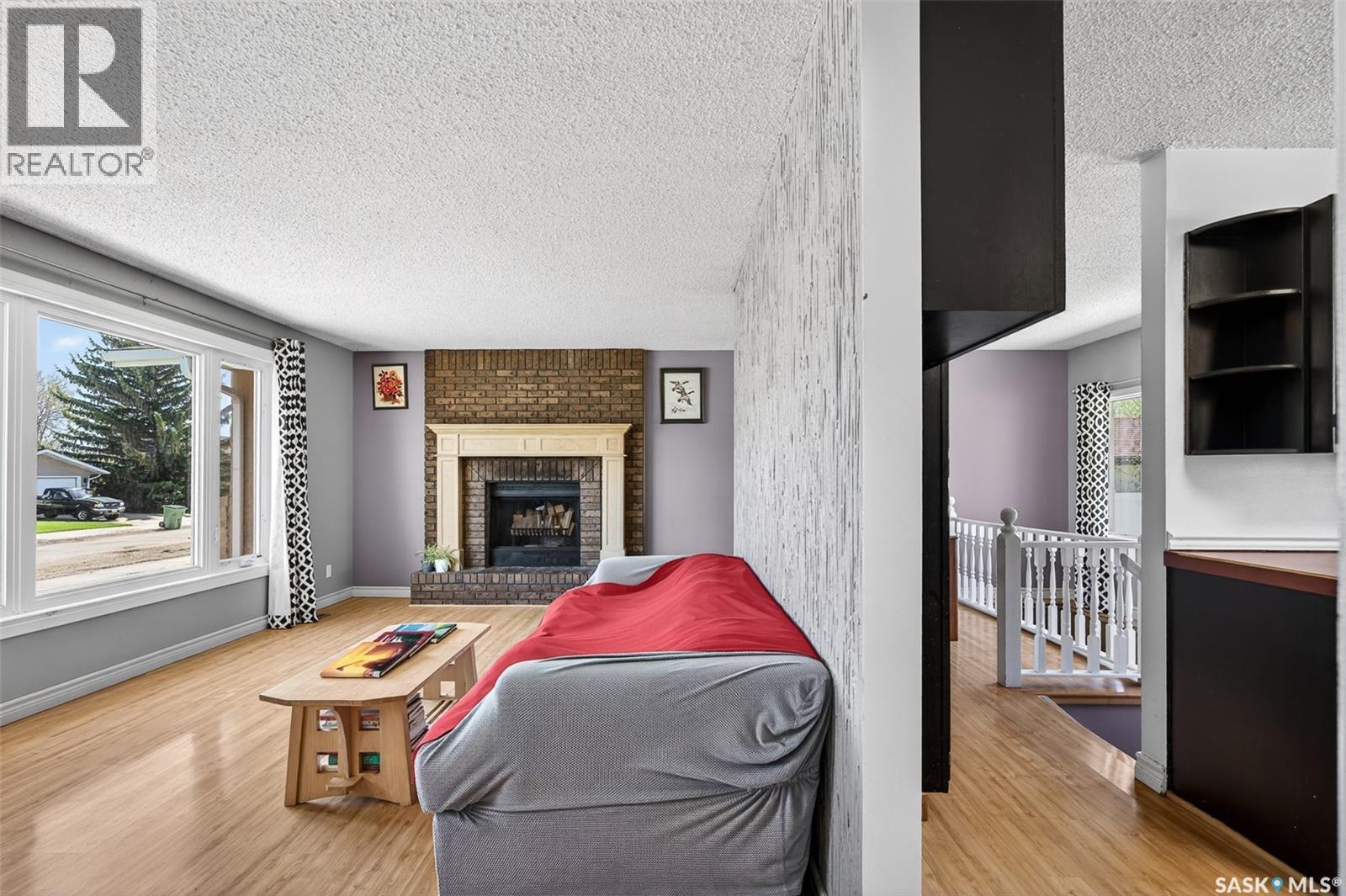22 Edelweiss Crescent, Moose Jaw, SK - Indoor Photo Showing Living Room With Fireplace