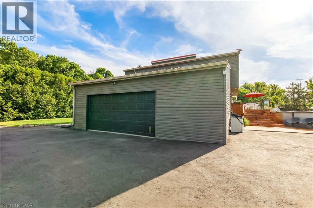 oversized heated 2 car attached garage - 657 Windham Road 14 Road, Simcoe, ON - Outdoor