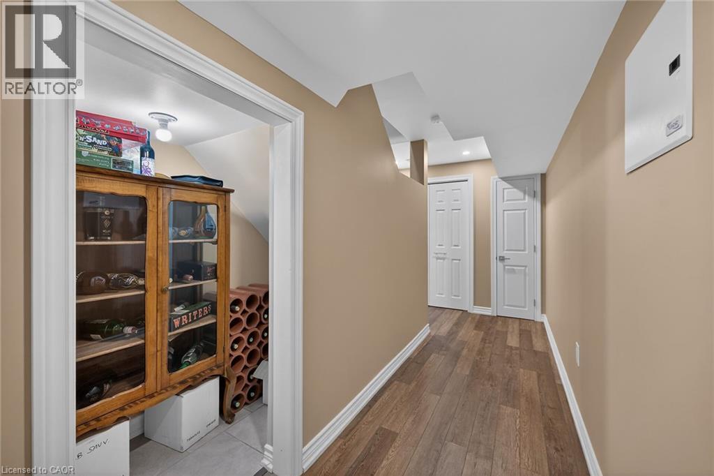 Recessed alcove storage featuring a built-in light fixture and tile flooring - 149 Kinsman Drive, Binbrook, ON