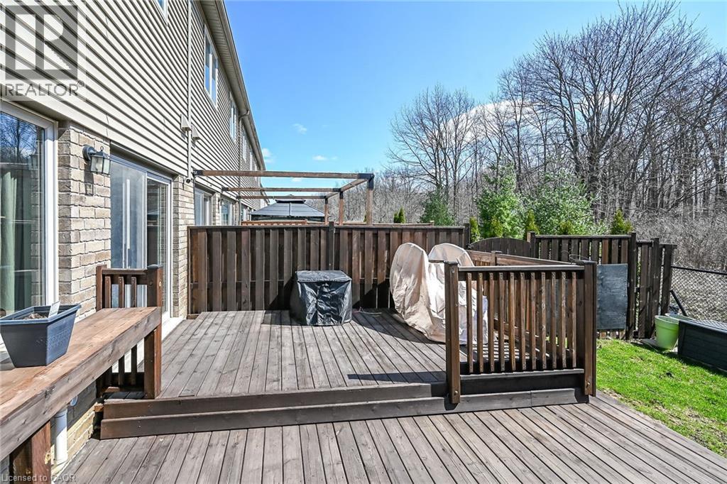 Multi-level wood deck featuring a privacy fence and a pergola structure - 149 Kinsman Drive, Binbrook, ON