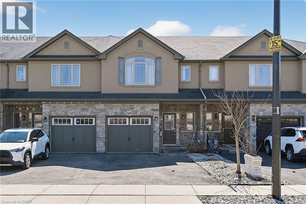 Exterior showcasing stone and stucco facade, gable rooflines, and multiple windows - 149 Kinsman Drive, Binbrook, ON