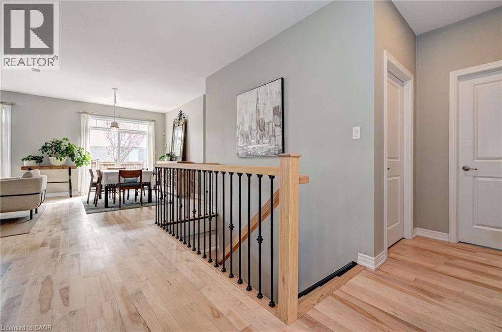 Open-concept interior featuring light wood-finish flooring throughout - 219 Falconridge Drive, Kitchener, ON - Indoor Photo Showing Other Room
