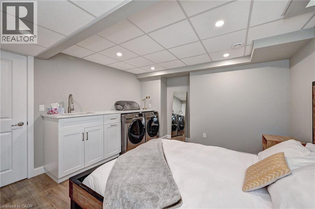 Laundry area with white cabinetry, a sink, and a countertop - 219 Falconridge Drive, Kitchener, ON - Indoor Photo Showing Bedroom