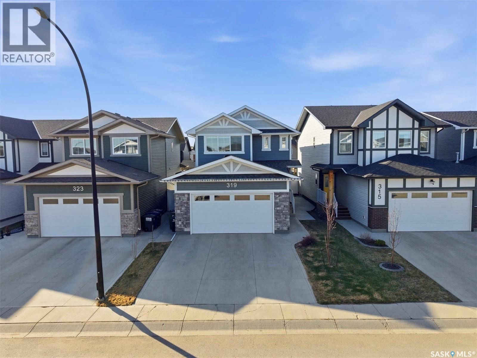 319 Skopik Crescent, Saskatoon, SK - Outdoor With Facade