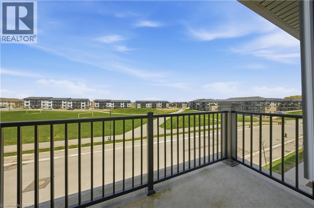 Private balcony featuring a concrete surface and black metal railings - 176 Wheat Lane, Kitchener, ON - Outdoor With Balcony With View With Exterior